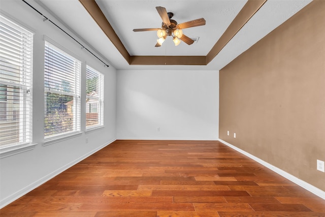 7402 Hollister Rdg, Houston, TX 77040 - empty room with a tray ceiling, wood finished floors, and ceiling fan
