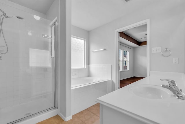 7402 Hollister Rdg, Houston, TX 77040 - full bath with a stall shower, a bath, vanity, and tile patterned floors
