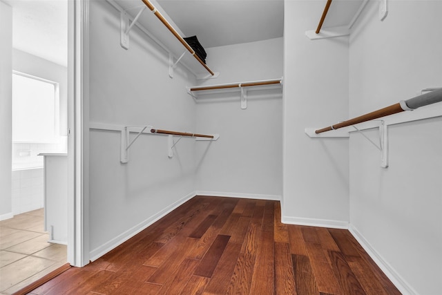 7402 Hollister Rdg, Houston, TX 77040 - walk in closet with wood finished floors