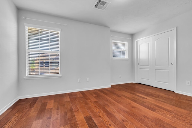 7402 Hollister Rdg, Houston, TX 77040 - unfurnished bedroom featuring wood finished floors and a closet