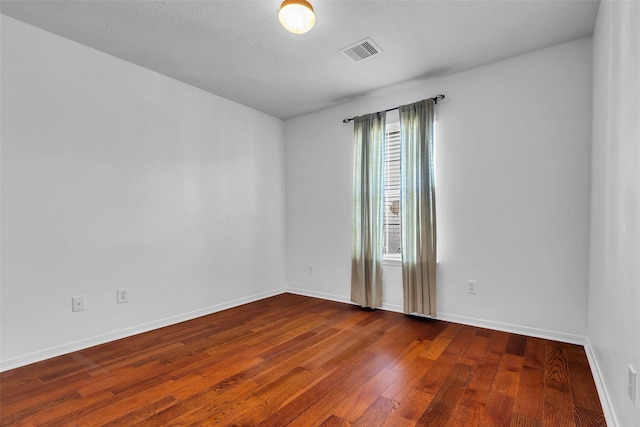 7402 Hollister Rdg, Houston, TX 77040 - spare room with wood finished floors and baseboards