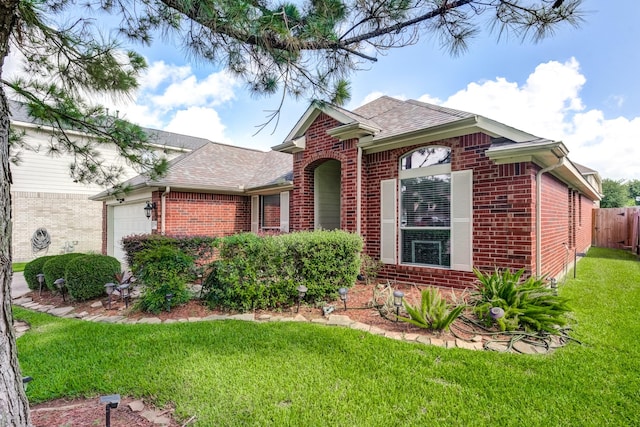 17906 Keenan Cv, Houston, TX 77084 - view of front of property featuring brick siding, a garage, and a shingled roof