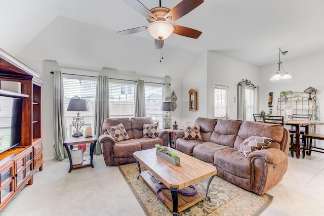 17906 Keenan Cv, Houston, TX 77084 - living room with vaulted ceiling, a ceiling fan, and light colored carpet
