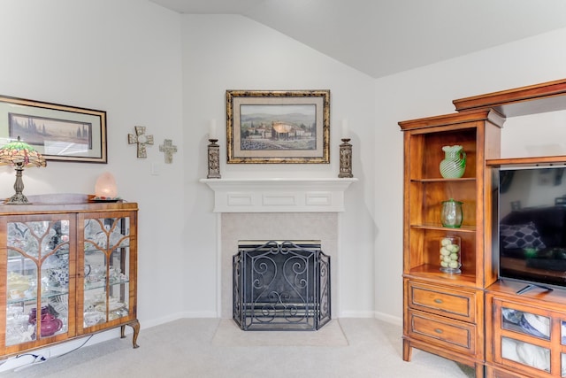 17906 Keenan Cv, Houston, TX 77084 - living room featuring carpet floors, lofted ceiling, and a fireplace with flush hearth