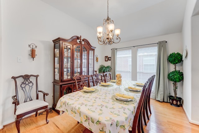 17906 Keenan Cv, Houston, TX 77084 - dining space featuring light wood-style flooring, a chandelier, and vaulted ceiling