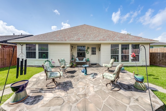 17906 Keenan Cv, Houston, TX 77084 - rear view of property featuring a shingled roof and a patio