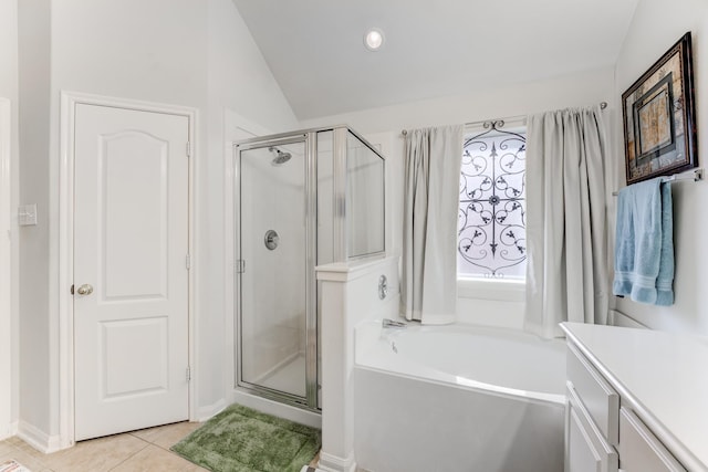 17906 Keenan Cv, Houston, TX 77084 - full bathroom featuring a shower stall, a bath, tile patterned flooring, lofted ceiling, and vanity