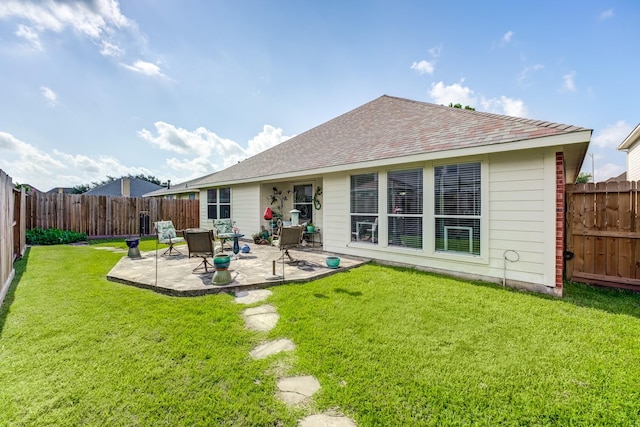 17906 Keenan Cv, Houston, TX 77084 - rear view of property featuring a fenced backyard, a patio, and roof with shingles