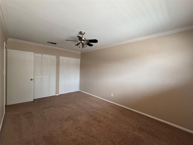 2219 Triway Ln Unit 240, Houston, TX 77043 - unfurnished bedroom with multiple closets, ornamental molding, carpet flooring, and ceiling fan