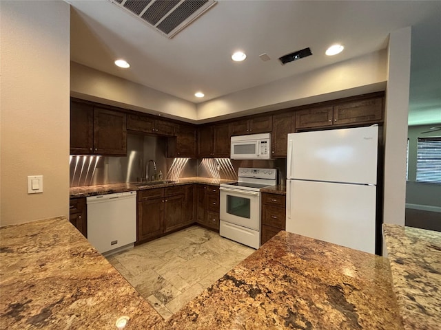 2219 Triway Ln Unit 240, Houston, TX 77043 - kitchen with white appliances, dark brown cabinetry, recessed lighting, stone counters, and stone tile flooring