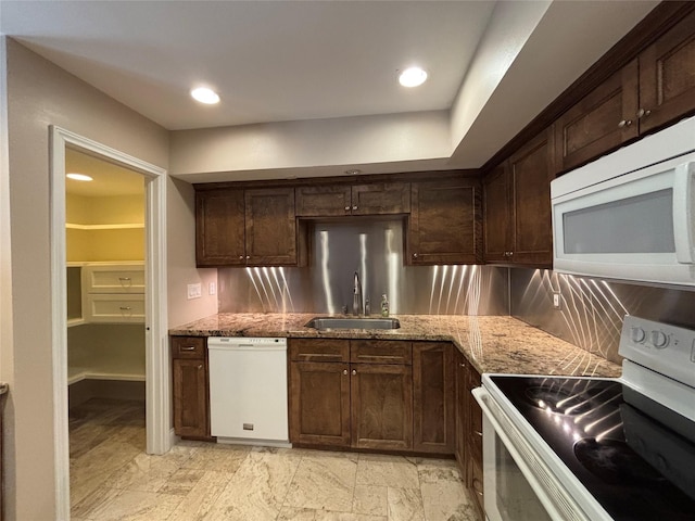 2219 Triway Ln Unit 240, Houston, TX 77043 - kitchen featuring white appliances, decorative backsplash, light stone countertops, and recessed lighting