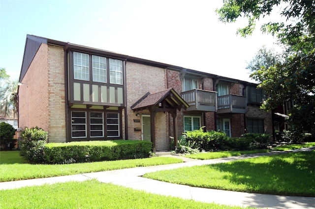 2219 Triway Ln Unit 240, Houston, TX 77043 - view of front facade with brick siding and a front lawn