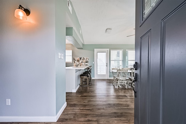 4023 Spanish Main Blvd, Galveston, TX 77554 - hallway featuring plenty of natural light and dark wood-type flooring