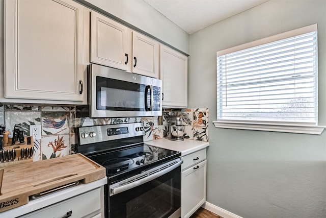4023 Spanish Main Blvd, Galveston, TX 77554 - kitchen with stainless steel appliances, tasteful backsplash, and light countertops