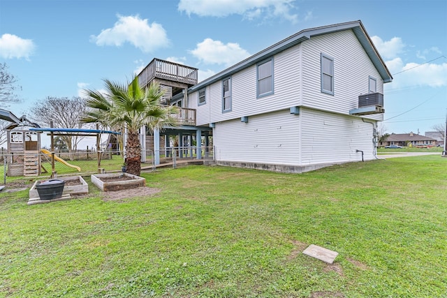 4023 Spanish Main Blvd, Galveston, TX 77554 - back of house with a balcony and a playground
