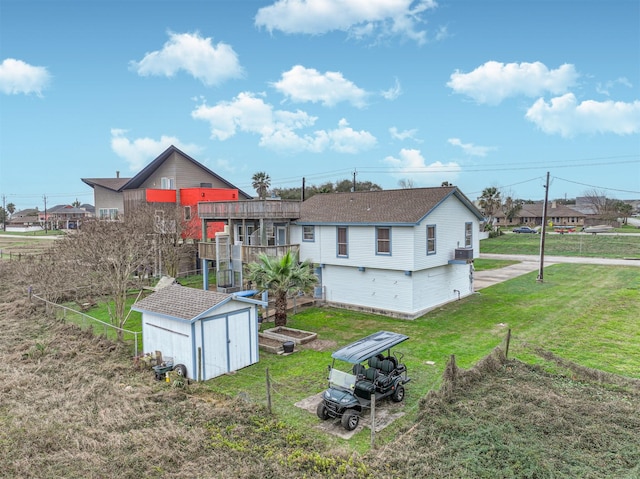 4023 Spanish Main Blvd, Galveston, TX 77554 - back of house with a shed, a yard, and roof with shingles