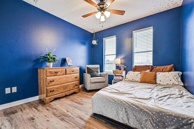 4023 Spanish Main Blvd, Galveston, TX 77554 - bedroom with wood finished floors and a ceiling fan