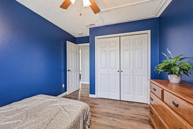 4023 Spanish Main Blvd, Galveston, TX 77554 - bedroom featuring wood finished floors, a closet, and ceiling fan