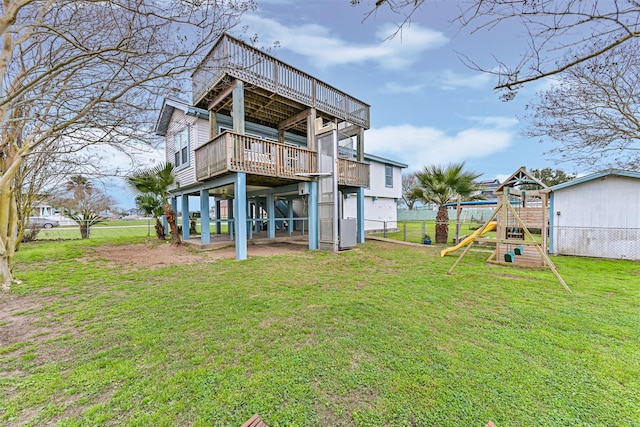 4023 Spanish Main Blvd, Galveston, TX 77554 - back of house featuring a playground and a wooden deck