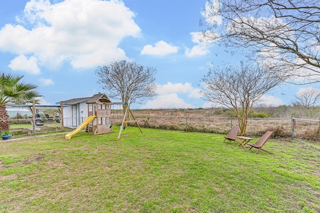 4023 Spanish Main Blvd, Galveston, TX 77554 - fenced backyard featuring a playground