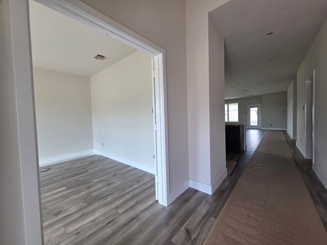2035 Winepress Rd, Brenham, TX 77833 - corridor with wood finished floors and baseboards