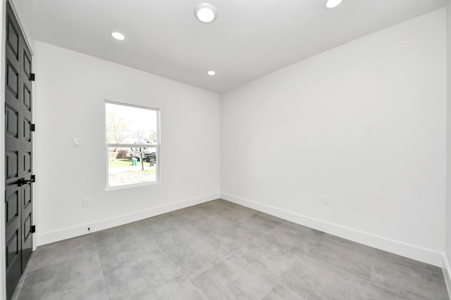 417 Harold Ln, Baytown, TX 77521 - empty room with recessed lighting and concrete floors