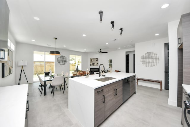 417 Harold Ln, Baytown, TX 77521 - kitchen with modern cabinets, black dishwasher, recessed lighting, light countertops, and a kitchen island with sink