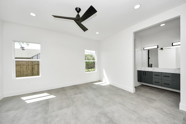 417 Harold Ln, Baytown, TX 77521 - unfurnished bedroom featuring recessed lighting, ensuite bathroom, finished concrete flooring, and a ceiling fan
