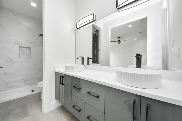 417 Harold Ln, Baytown, TX 77521 - full bathroom featuring double vanity, a marble finish shower, ceiling fan, and recessed lighting