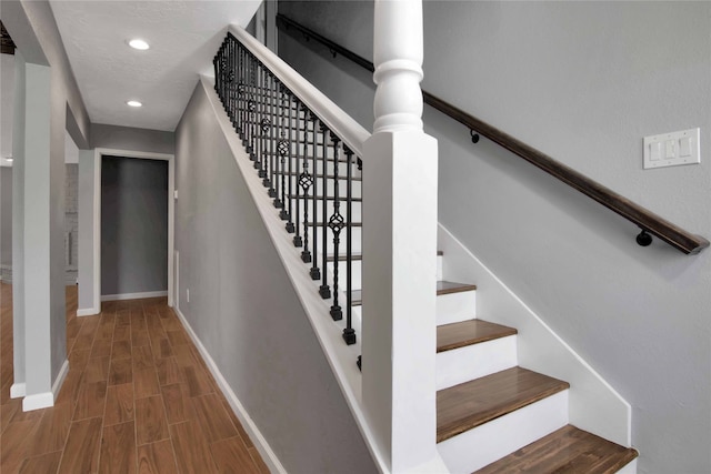 12811 Golden Tee Ln, Houston, TX 77099 - staircase with wood finished floors and recessed lighting