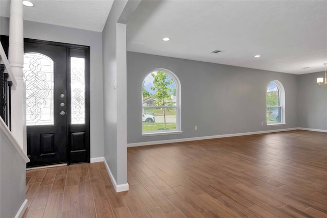 12811 Golden Tee Ln, Houston, TX 77099 - foyer with wood finished floors, a chandelier, and recessed lighting