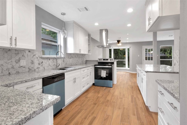 12811 Golden Tee Ln, Houston, TX 77099 - kitchen with dishwasher, island exhaust hood, range with electric cooktop, a ceiling fan, and white cabinetry
