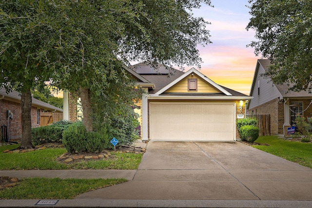 3015 Crescent Oaks Park Ln, Spring, TX 77386 - view of front of property with driveway, brick siding, roof mounted solar panels, and a garage