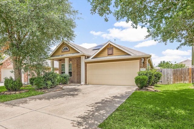 3015 Crescent Oaks Park Ln, Spring, TX 77386 - view of front facade featuring brick siding, roof mounted solar panels, an attached garage, concrete driveway, and roof with shingles