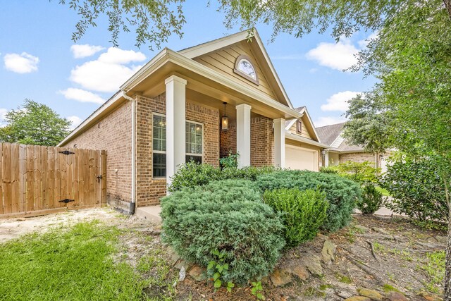 3015 Crescent Oaks Park Ln, Spring, TX 77386 - view of home's exterior featuring brick siding and a garage