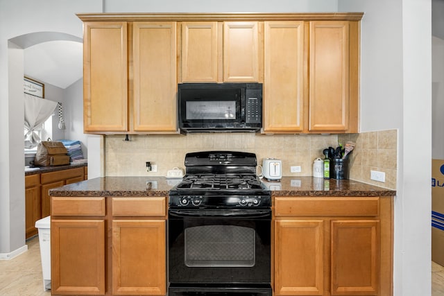 3015 Crescent Oaks Park Ln, Spring, TX 77386 - kitchen with black appliances, arched walkways, dark stone counters, and tasteful backsplash