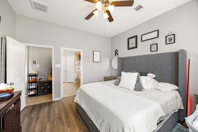 3015 Crescent Oaks Park Ln, Spring, TX 77386 - bedroom featuring dark wood finished floors, ceiling fan, and ensuite bath