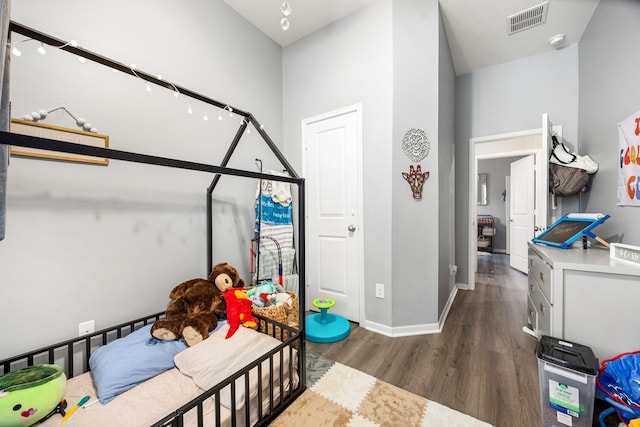 3015 Crescent Oaks Park Ln, Spring, TX 77386 - bedroom featuring wood finished floors and baseboards