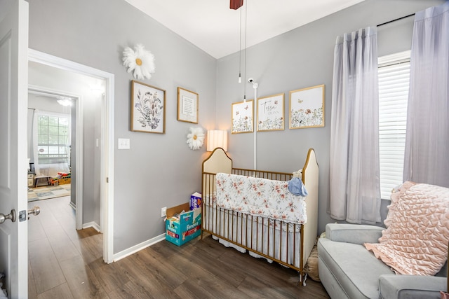 3015 Crescent Oaks Park Ln, Spring, TX 77386 - bedroom with a nursery area, wood finished floors, and ceiling fan