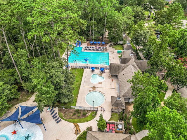 3015 Crescent Oaks Park Ln, Spring, TX 77386 - aerial view of a pool area and a tree filled landscape