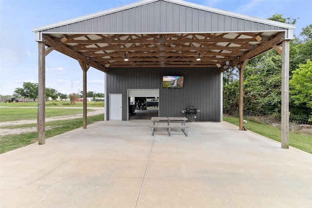 500 E Main St, Clute, TX 77531 - view of patio / terrace featuring a garage and grilling area