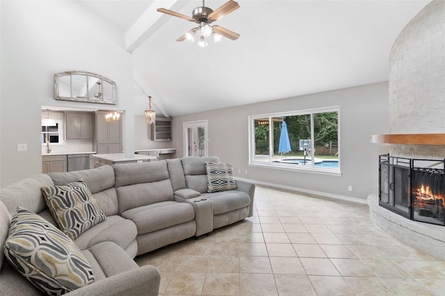 500 E Main St, Clute, TX 77531 - living room with light tile patterned floors, a fireplace, ceiling fan, and high vaulted ceiling