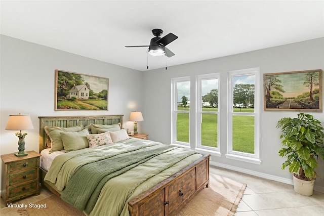 500 E Main St, Clute, TX 77531 - bedroom featuring a ceiling fan and light tile patterned flooring