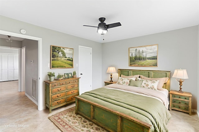500 E Main St, Clute, TX 77531 - bedroom featuring light tile patterned flooring and ceiling fan