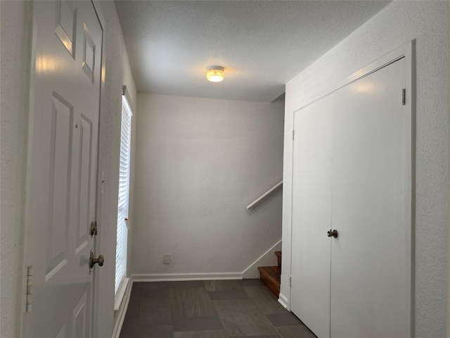 6201 Ranchester Dr Unit 48, Houston, TX 77036 - foyer featuring stairway and a textured ceiling