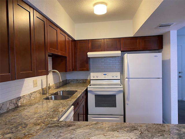 6201 Ranchester Dr Unit 48, Houston, TX 77036 - kitchen featuring white appliances, under cabinet range hood, tasteful backsplash, and stone counters