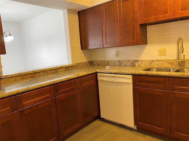 6201 Ranchester Dr Unit 48, Houston, TX 77036 - kitchen featuring white dishwasher, reddish brown cabinets, backsplash, and light stone counters