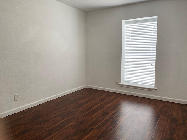 6201 Ranchester Dr Unit 48, Houston, TX 77036 - empty room featuring dark wood finished floors