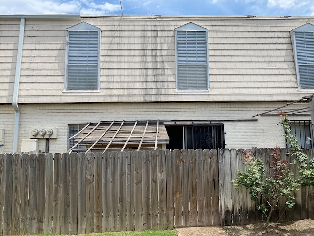 6201 Ranchester Dr Unit 48, Houston, TX 77036 - view of side of property featuring brick siding and mansard roof