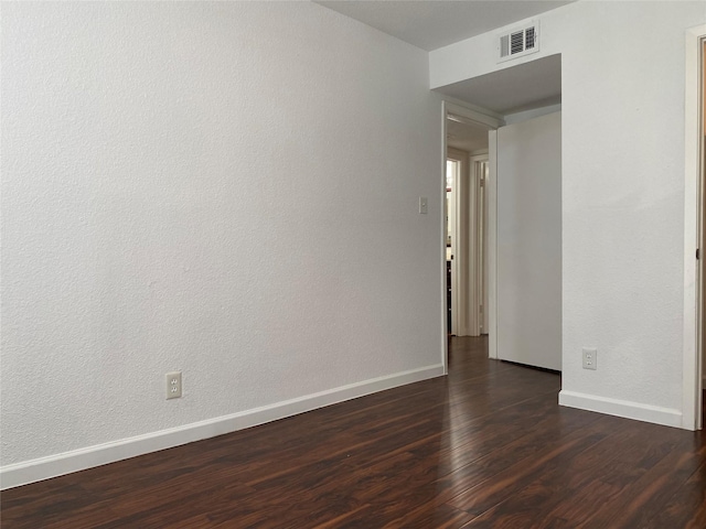 6201 Ranchester Dr Unit 48, Houston, TX 77036 - empty room with dark wood-style floors and baseboards